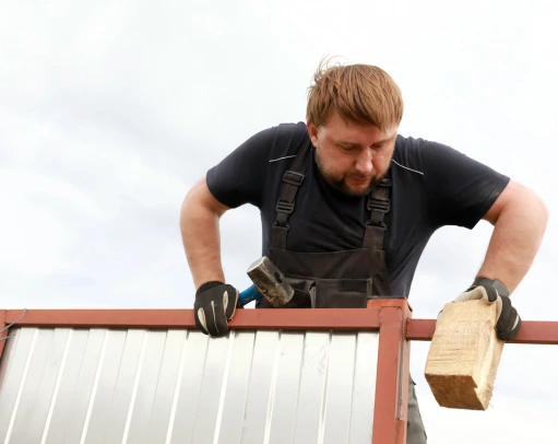 repairing-fence-near-house